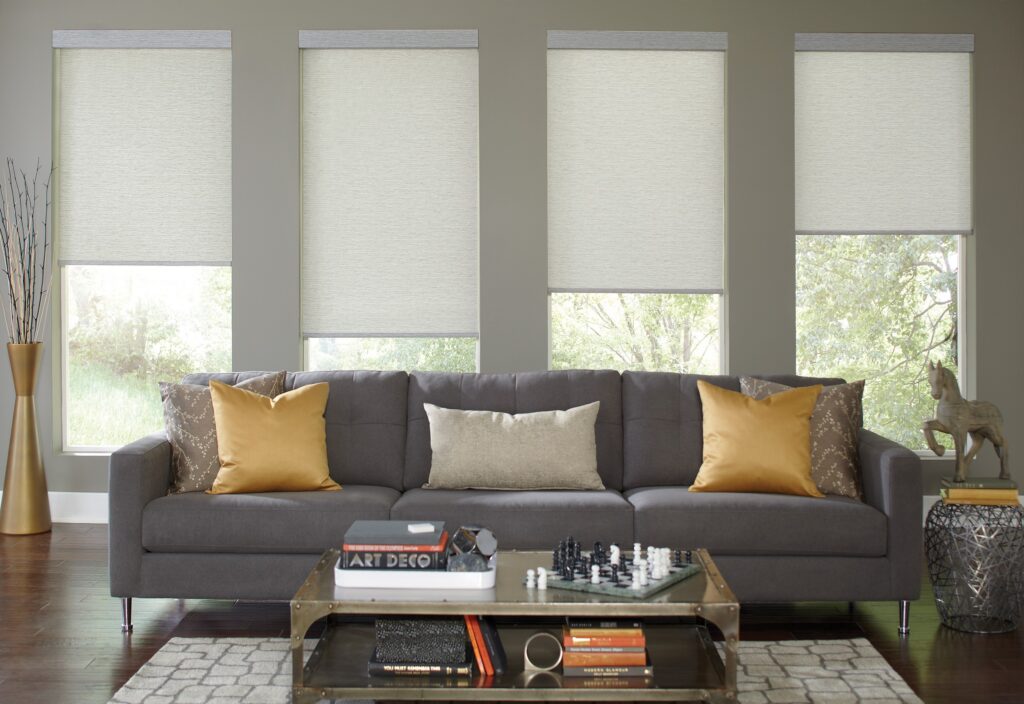 Multiple roller shade fabrics installed in a modern living room in Bridgeland, TX
