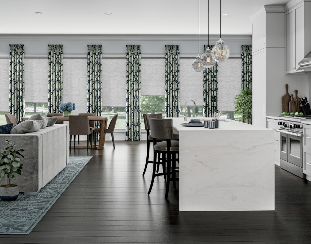 Roller shades paired with floor-length drapery panels in a luxury open-plan Bridgeland home