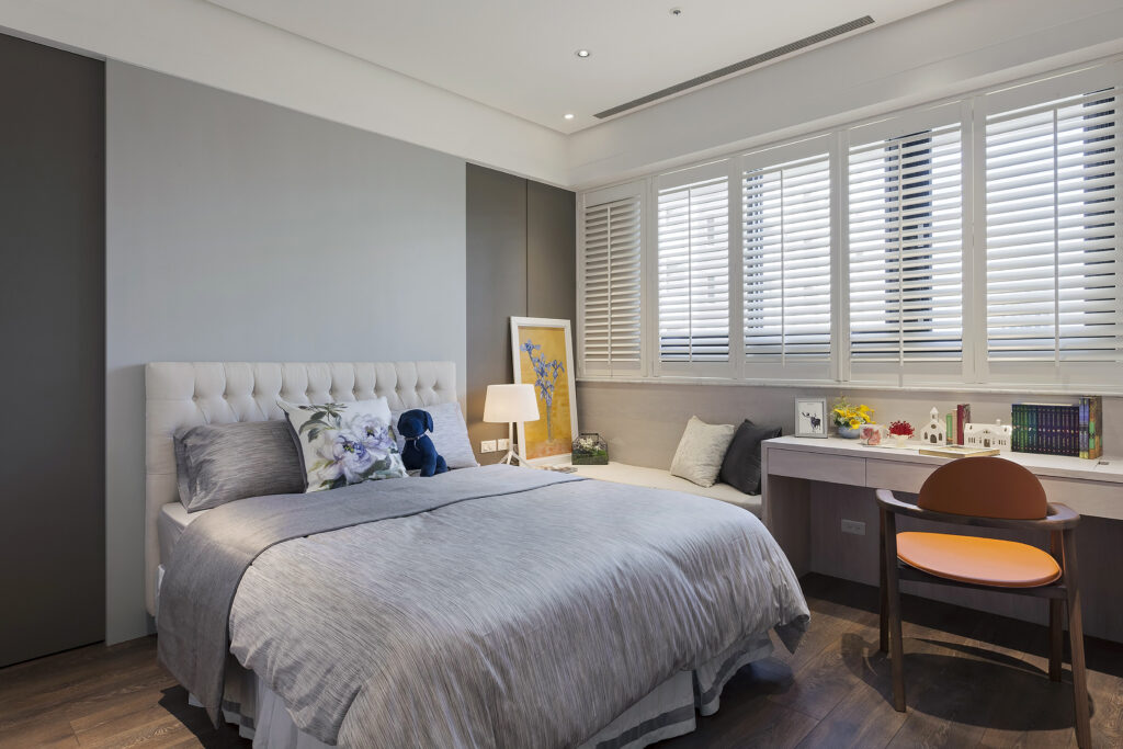 Elegant wood shutters installed in a neutral toned bedroom in Bridgeland TX